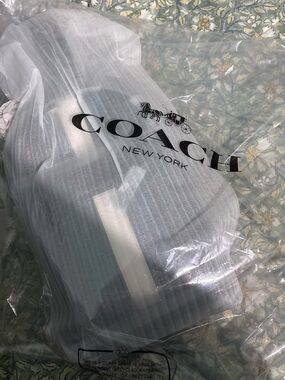 Coach Gray and White Coach Hang Tag on Fabric